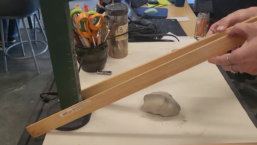 Rolling a slab of clay